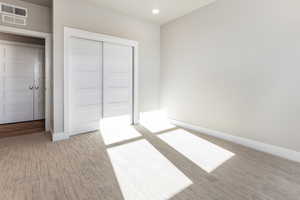 Unfurnished bedroom with a closet