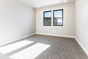 View of carpeted spare room