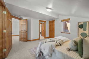 Bedroom with lofted ceiling and ensuite bath