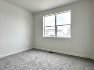 Unfurnished room featuring carpet flooring