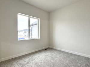 View of carpeted spare room