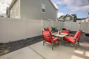 Back patio. Fully vinyl fence with gate to RV parking.