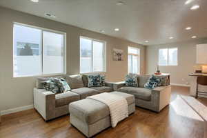 Living room with light hardwood / wood-style flooring