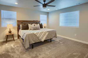 Primary bedroom featuring ceiling fan