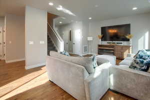 Living room with hardwood / wood-style flooring