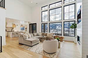 Living room with vaulted ceilings and mountain views