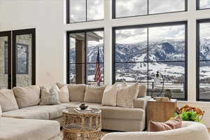 Living room featuring a mountain view and plenty of natural light