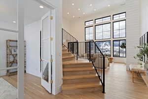 Stairway with vaulted ceilings and french doors