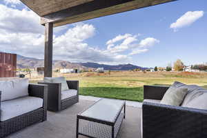 View of patio featuring outdoor lounge area and a mountain view