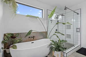 Bathroom with shower with separate bathtub