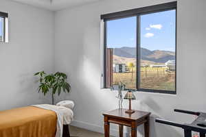 Bedroom with a mountain view and carpet floors