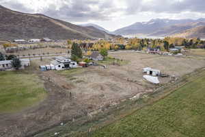 Birds eye view of property with a mountain view and a rural view