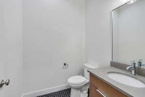 Bathroom with vanity and toilet