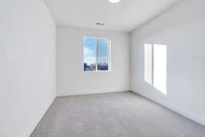 Unfurnished room featuring carpet floors