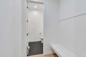 Bathroom featuring tile patterned floors and toilet