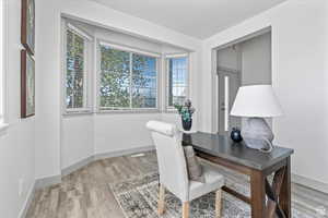 Office area featuring light hardwood / wood-style floors