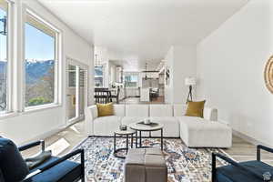 Living room featuring light hardwood / wood-style floors and a chandelier