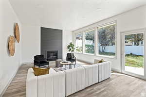 Living room featuring light hardwood / wood-style floors and a fireplace