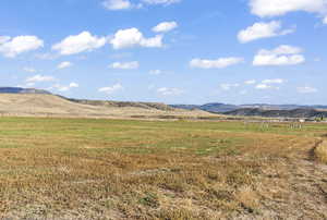 Property view of mountains featuring a rural view