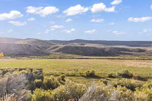 Property view of mountains with a rural view