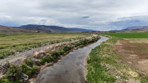 View of mountain backdrop featuring rural landscape