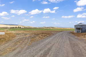 View of street with a mountain view and a rural view