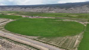 View of mountain background featuring rural landscape