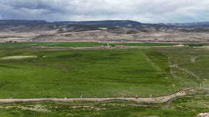 View of mountain backdrop with rural landscape