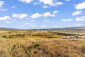 Property view of mountains with a rural view