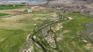Aerial view of property and surrounding area with mountains