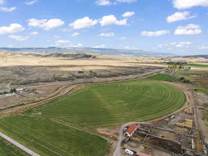 Drone / aerial view with a mountain view and a rural view