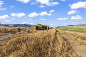 View of yard featuring a mountain view and a rural view