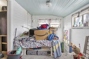 Bedroom featuring lofted ceiling