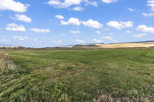 View of yard with a mountain view and a rural view