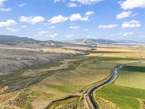 Birds eye view of property featuring a mountain view and a rural view