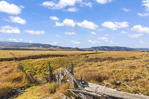 Property view of mountains with a rural view