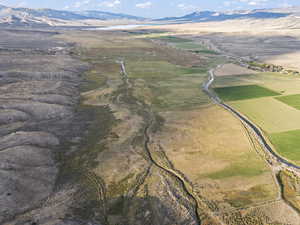 Birds eye view of property with a mountain view and a rural view