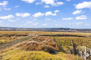 Property view of mountains featuring a rural view