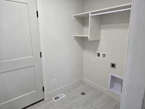 Washroom with hookup for an electric dryer and washer hookup