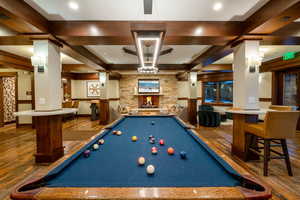 Rec room with beam ceiling, hardwood / wood-style flooring, coffered ceiling, and billiards