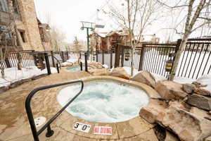 Exterior space with a hot tub