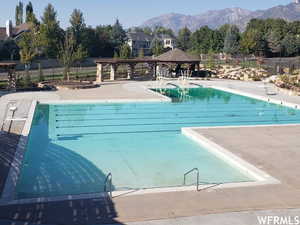 View of pool featuring a mountain view, a gazebo, and a patio