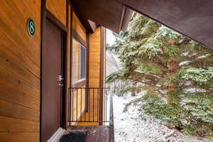 View of snow covered property entrance