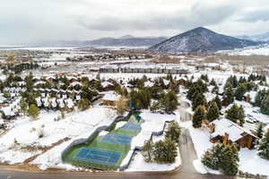 Snowy aerial view with a mountain view