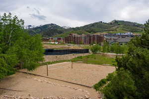 View of home's community featuring a mountain view and volleyball court