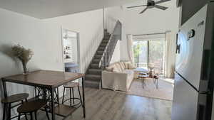 Living room featuring light hardwood / wood-style flooring and ceiling fan