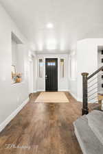 Foyer featuring a textured ceiling and hardwood / wood-style flooring