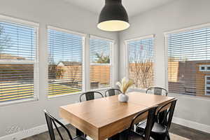 Dining area featuring dark hardwood / wood-style flooring