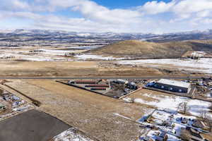 Snowy aerial view featuring a mountain view