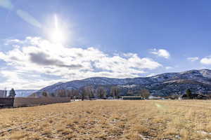 Property view of mountains with a rural view